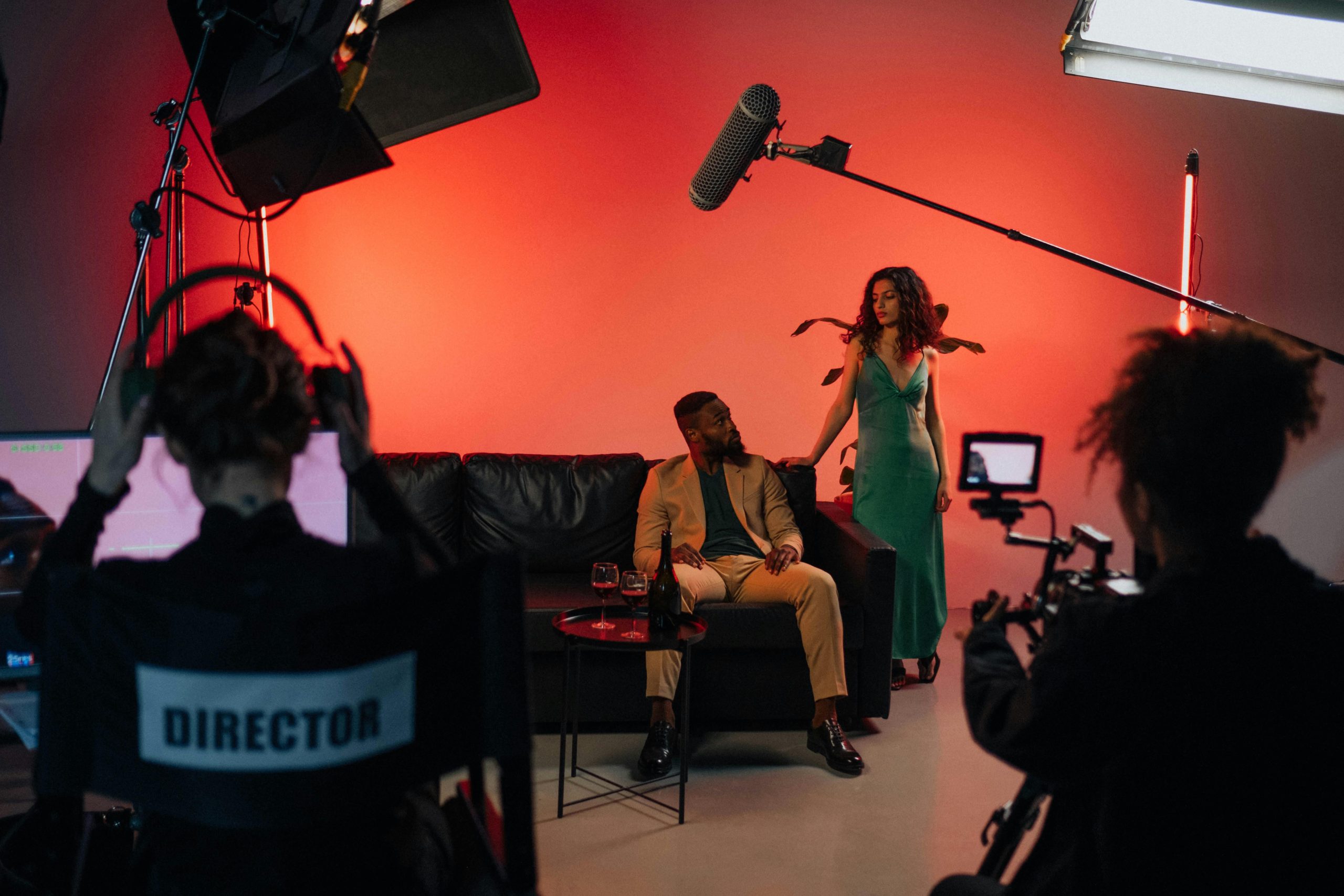 A dynamic film set with actors and crew actively engaged in a studio environment.